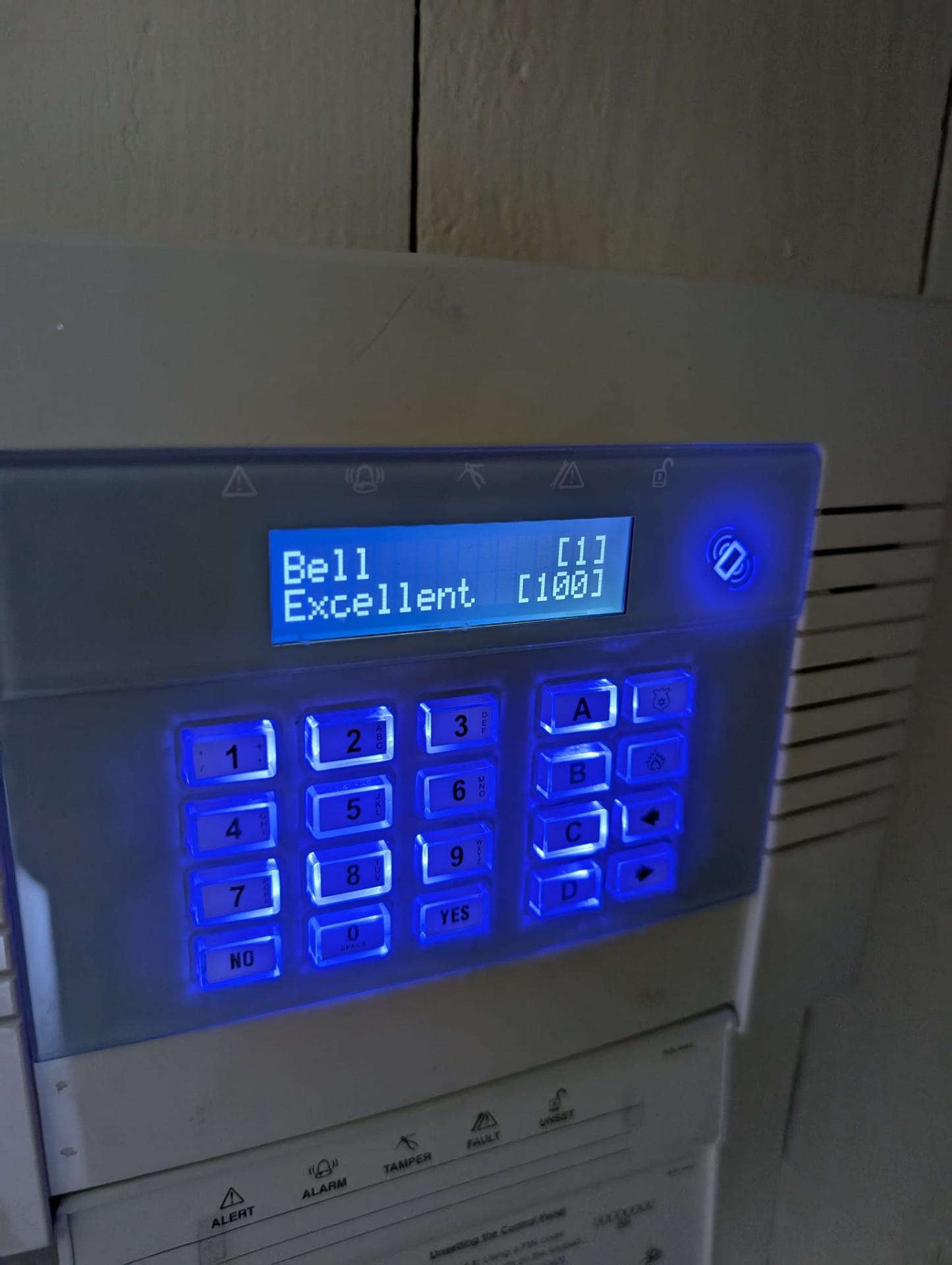 Texecom alarm keypad with blue LCD display showing system status