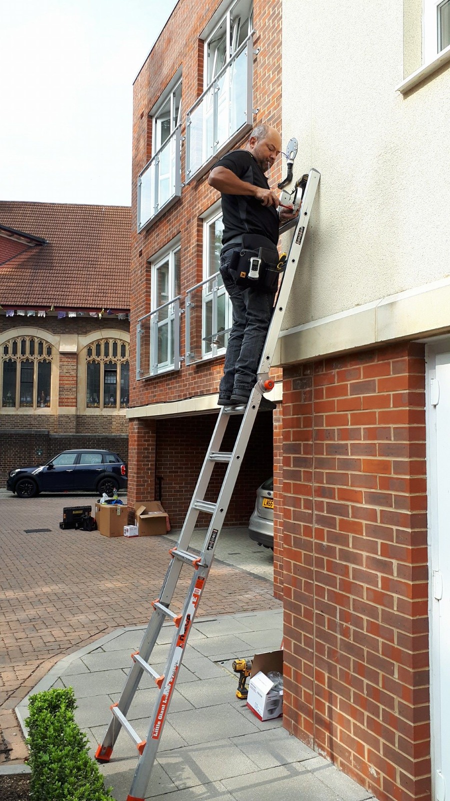 Eagle All Security engineer installing a security system on a London property